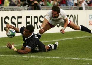 Fiji's legendary Sevens playmaker Waisale Serevi reaches for the line during the Cup semi-final against England, Fiji v England, World Cup Sevens, Hong Kong Stadium, March 20 2005.