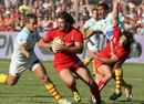 Toulouse scrum-half Byron Kelleher looks for some space in Perpignan