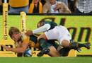 Australia's Lachie Turner is tackled by South Africa's Bryan Habana