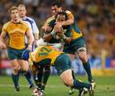 South Africa's Odwa Ndungane is double-teamed by the Australia defence