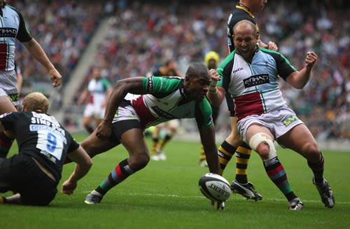 Quins wing Ugo Monye dives on the loose ball to score