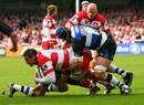 Gloucester's Gareth Delve is tackled by the Bath defence