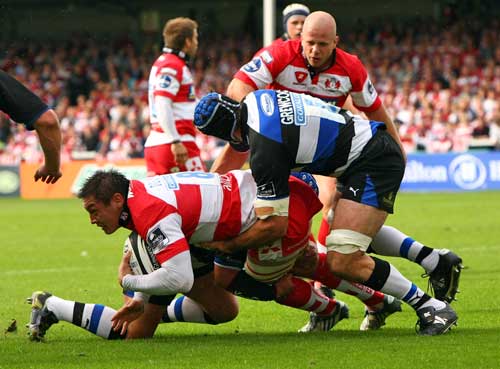 Gloucester's Gareth Delve is tackled by the Bath defence