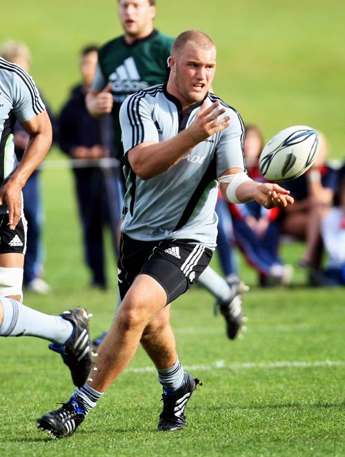 Owen Franks passes the ball during an All Blacks training session