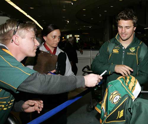 South Africa flanker Heinrich Brussow signs an autograph