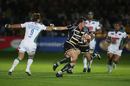 Worcester's Tom Wood goes past Andy Gomarsall at Sixways