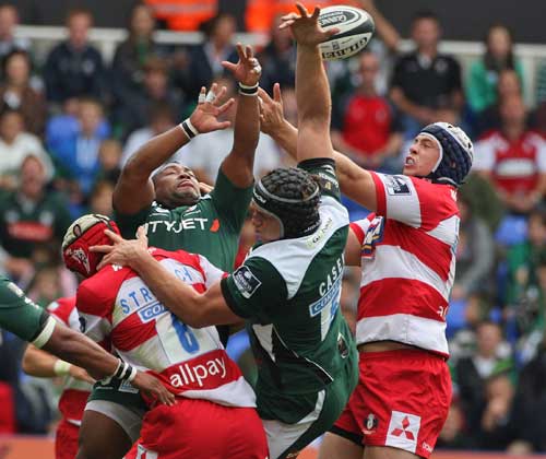 London Irish and Gloucester compete for the ball