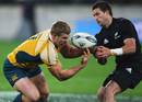 Australia flanker David Pocock vies for the ball with Cory Jane
