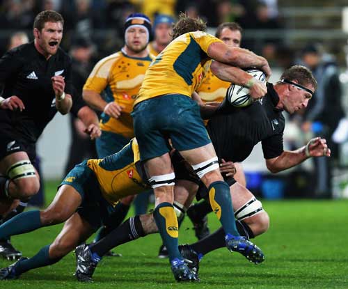 All Blacks lock Brad Thorn is swamped by the Australia defence