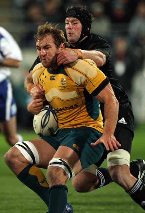 Australia flanker Rocky Elsom is clattered by Tom Donnelly