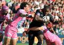 Toulouse wing Yves Donguy crashes in to the Stade Francais defence
