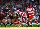 Saracens centre Brad Barritt crashes in to the Gloucester defence