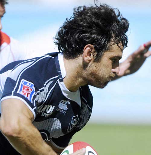 Castres wing Marc Andreu takes on the defence