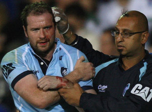 Geordan Murphy of Leicester is helped off the field after injuring his left arm during the Guinness Premiership match between Bath and Leicester Tigers at the Recreation Ground on September 26, 2009 in Bath, England. 