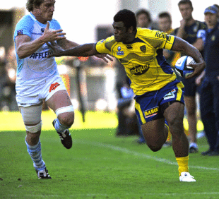 Clermont Auvergne's Fijian wing Napolioni Nalaga fends off Bayonne's David Martin during his side's win at Marcel Michelin, Clermont-Ferrand, France, October 3, 2009