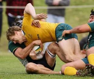 Australia's Ryan Cross is hauled down during a trial game in Sydney, Wallabies training session, St Ignatius College, Sydney, Australia, October 8, 2009