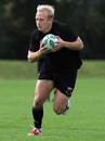 Northampton fly-half Shane Geraghty runs with the ball during training