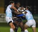 Worcester's Miles Benjamin is wrapped up by the Montpellier defence