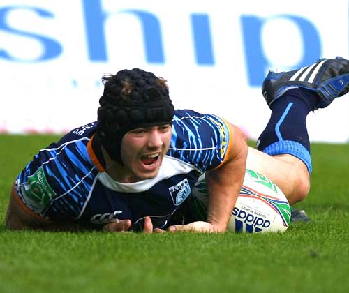 Cardiff Blues wing Leigh Halfpenny dives on a loose ball to score