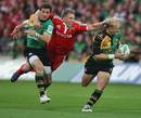Munster's Jean de Villiers attempts to tackle Northampton's Shane Geraghty