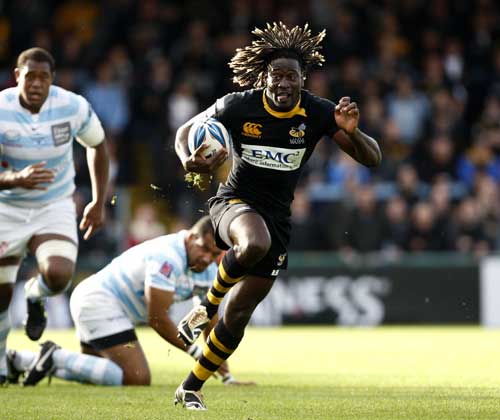 Wasps' Paul Sackey exploits a gap in the Racing Metro defence