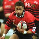 Sale wing Jason Robinson takes on the Bath defence