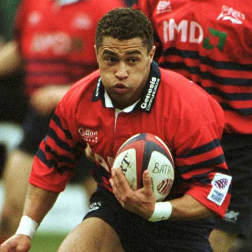 Sale wing Jason Robinson takes on the Bath defence