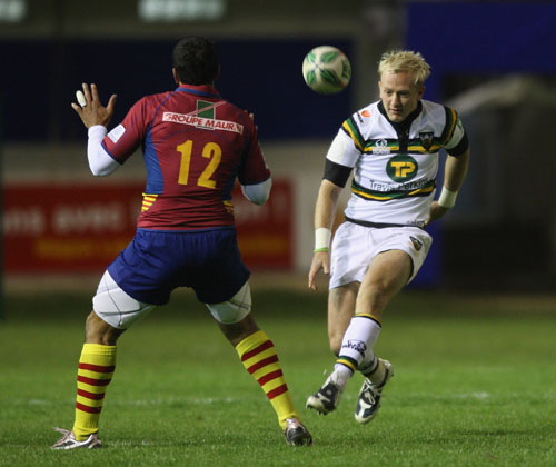 Northampton fly-half Shane Geraghty chips over the Perpignan defence