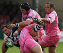 Bath centre Matt Carraro is swamped by the Stade defence