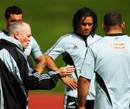 All Blacks coach Graham Henry makes a point during training