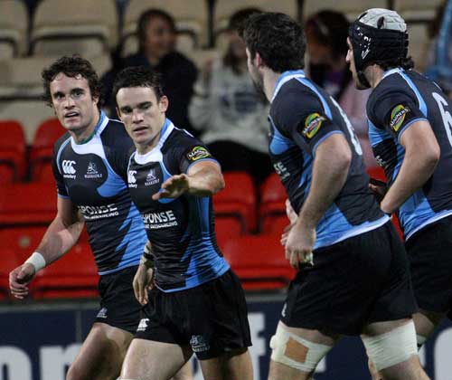 Glasgow Warriors centre Max Evans is congratulated after scoring on his comeback