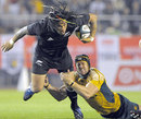 All Blacks centre Ma'a Nonu is tackled by Mark Chisholm 