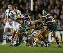 Northampton flanker Neil Best is swamped by the Leicester defence