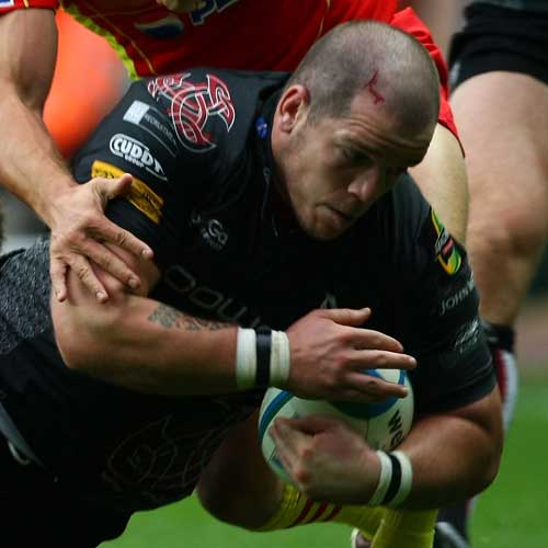 Paul James of the Ospreys is tackled
