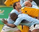 South Africa wing Francois Hougaard tests out tackles bags held by Gurthro Steenkamp and Chiliboy Ralepelle