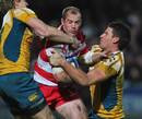 Gloucester's James Simpson-Daniel is shackled by the Australia defence