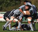 All Blacks captain Richie McCaw puts in a hit during a training session