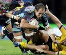 Stade Francais' Sergio Parisse is tackled by the Albi defence