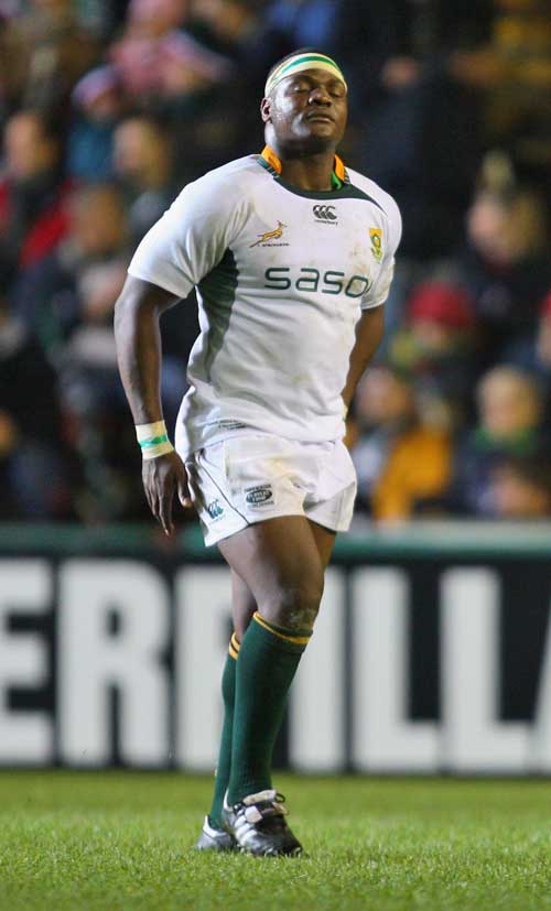 South Africa's Chiliboy Ralepelle limps out of the game with an injury