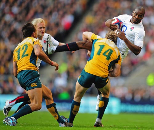 England fullback Ugo Monye is upended by Wallaby wing Peter Hynes