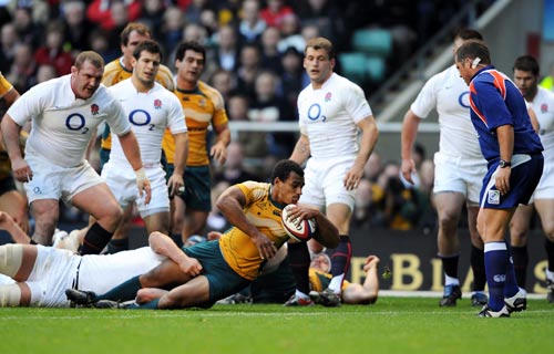 Wallaby scrum-half Will Genia burrows his way over the try-line