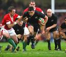 New Zealand's Dan Carter exploits a gap in the Wales defence