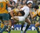 England's Dan Hipkiss is tackled by the Australia defence