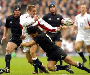 England's Jonny WIlkinson is tackled by New Zealand's Doug Howlett, England v New Zealand, Twickenham, England, November 9, 2009