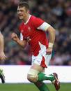 Wales' Dafydd Jones chases the action