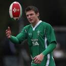 Wales fly-half Dan Biggar catches a ball during training