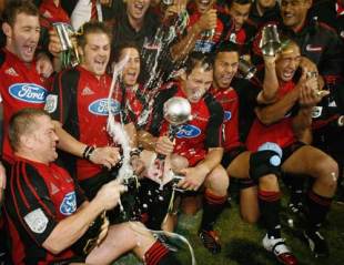 Cruaders players celebrate with the Super 14 trophy after their 19-12 win over the Hurricanes, Crusaders v Hurricanes, Super 14 final, Lancaster Park, May 27 2006.