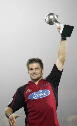 Crusaders captain Richie McCaw lifts the newly-crafted Super 14 trophy after his side's 19-12 win over the Hurricanes, Crusaders v Hurricanes, Super 14 final, Lancaster Park, May 27 2006.
