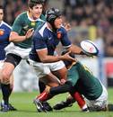 France's Thierry Dusautoir off loads the ball under pressure