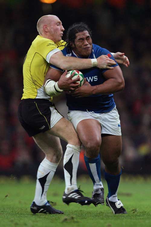 Wales' Tom Shanklin tackles Samoa's Henry Tuilagi high